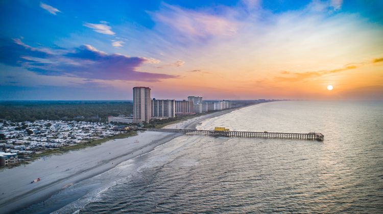 Surfside Beach, SC aerial view of beachline at sunset